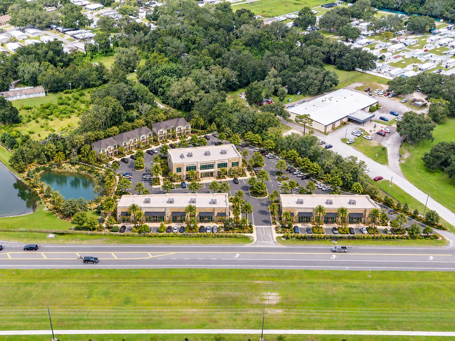 Illustrative mixed-use aerial with retail, office and residential buildings